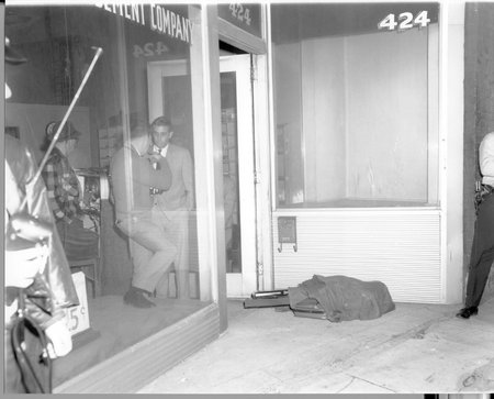 01Gun and Other Evidence Under Blanket 2.jpg